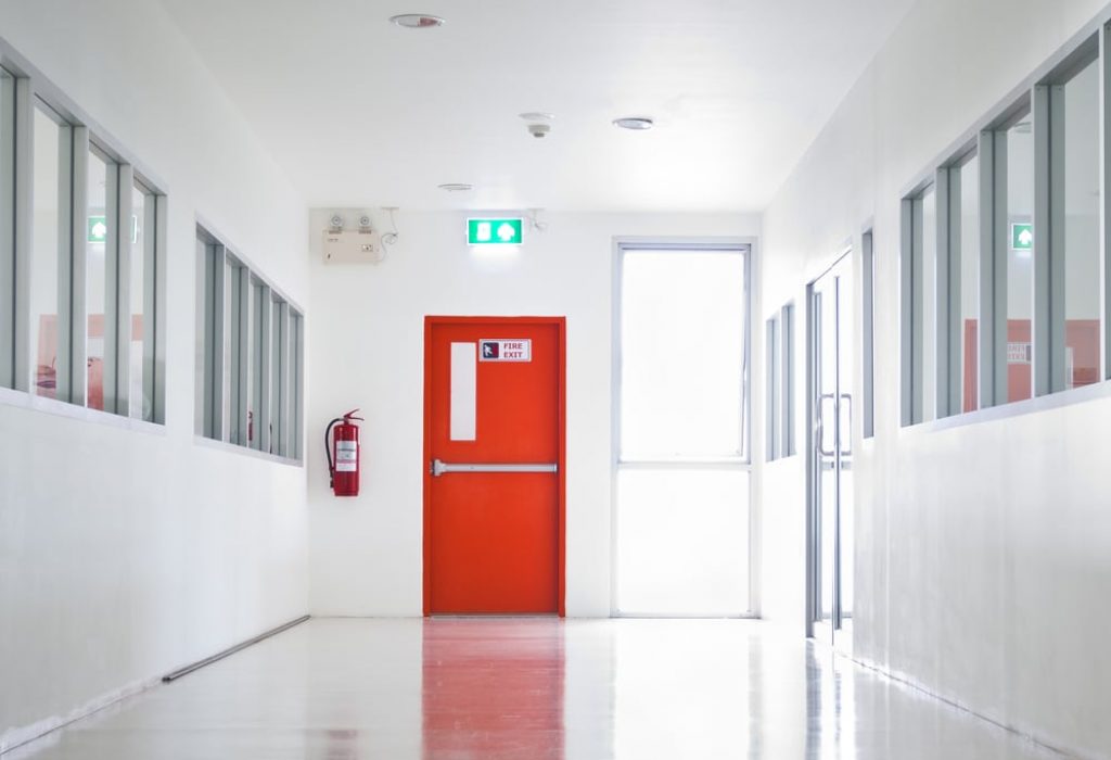 Building Emergency Exit with Exit Sign and Fire Extinguisher